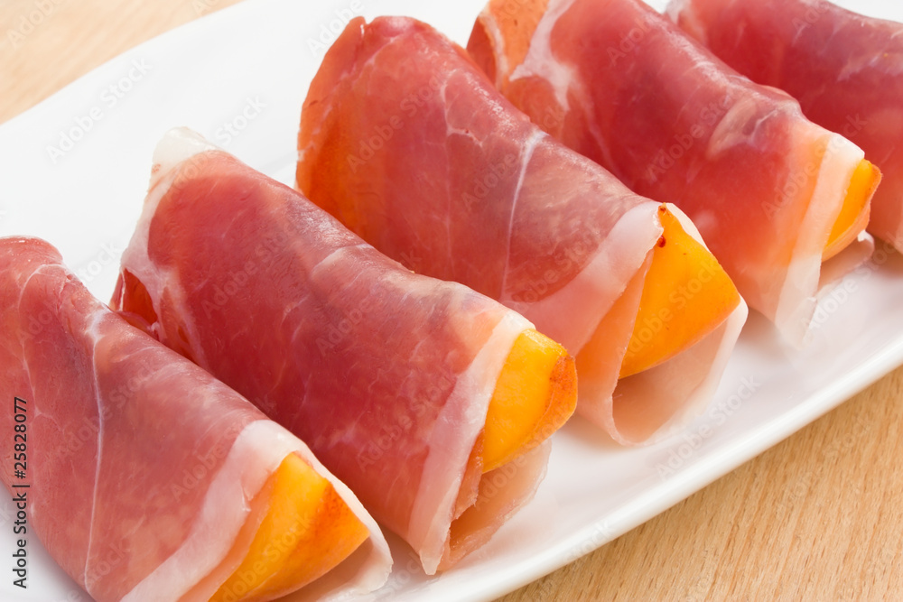 Slices of peach in Prosciutto Italian cured ham Slices of peach in Prosciutto Italian cured ham
