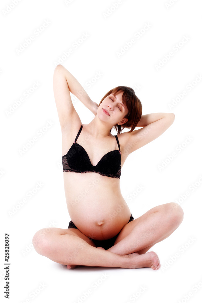 Fototapeta premium dreaming expectant mother 40 weeks isolated on white