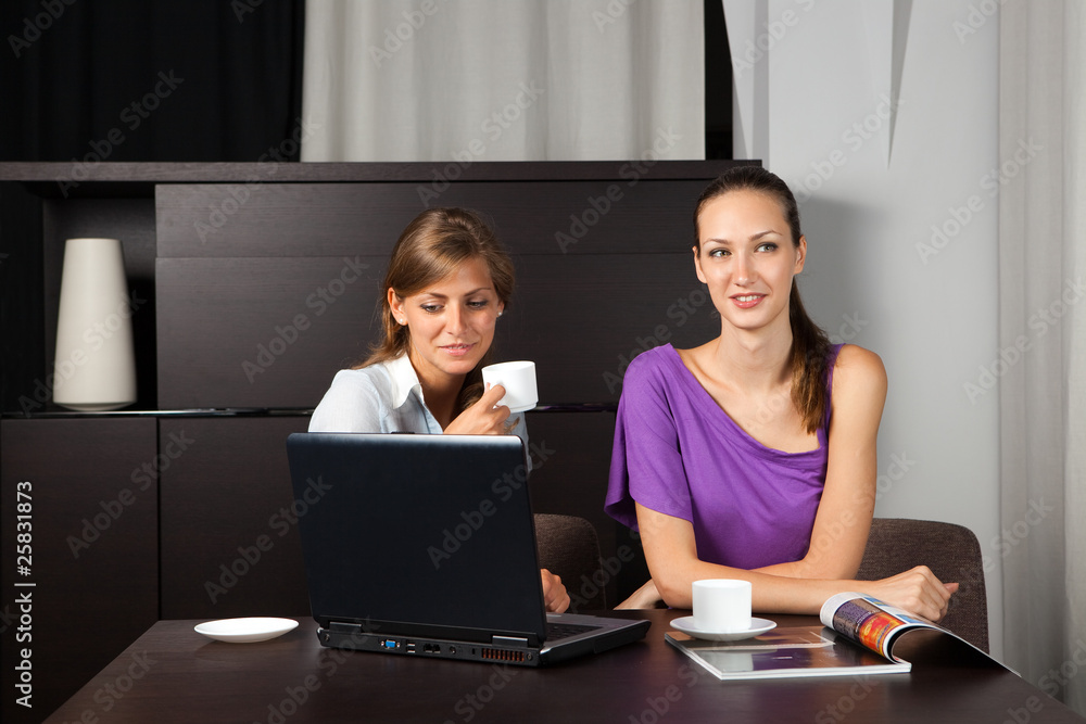 two young women having a coffee break