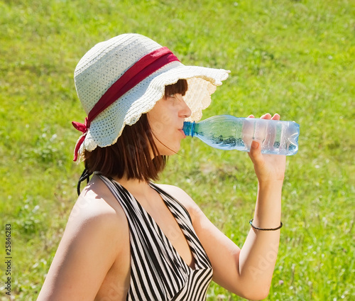 girl drinks water from bottle