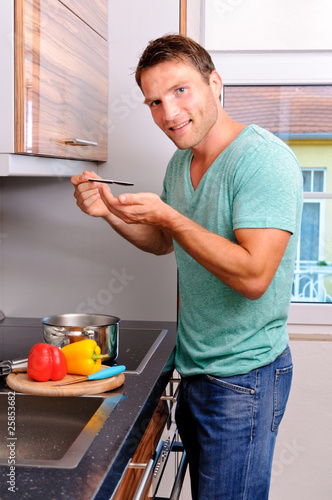 man is cooking in his kitchen