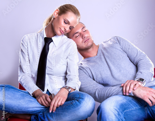 business team man laying on woman's shoulder photo
