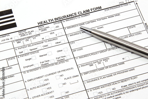 Health Insurance Claim Form with Silver Pen photo