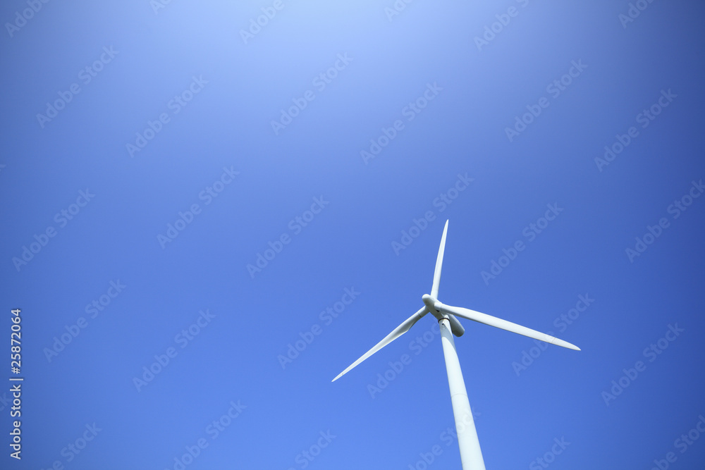 white windmill with blue and clear sky