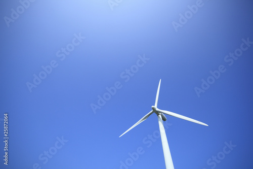 white windmill with blue and clear sky © MP_P