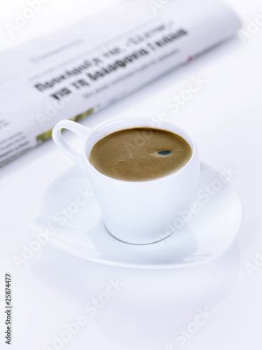 a greek coffee and a newspaper