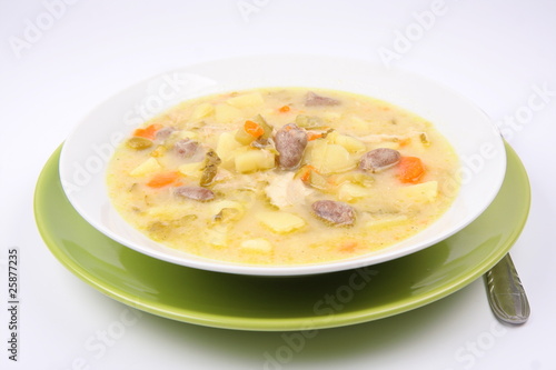 Pickled cucumber soup with some giblets, Polish cuisine
