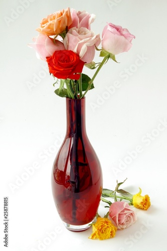 roses in red vase