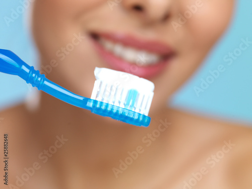 Portrait of beautiful woman with toothbrush