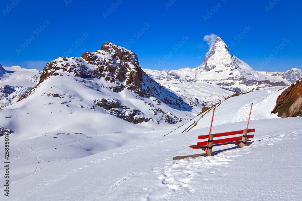 Red chair and Matterhorn Peak located in Switzerland