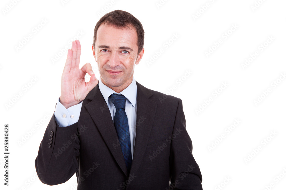 handsome businessman with thumb raised as a sign of ok handsome businessman with thumb raised as a sign of ok