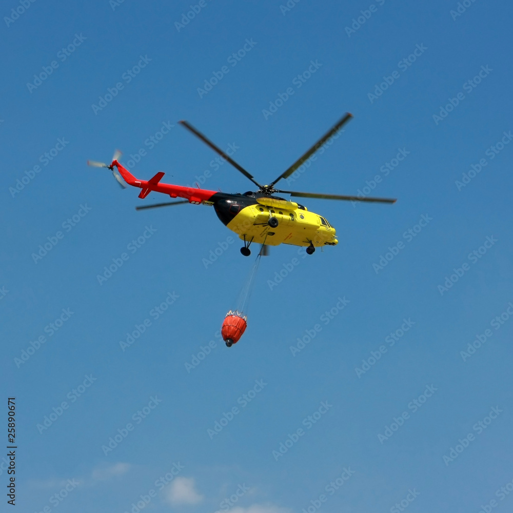 Fire rescue helicopter with water bucket - Square crop Fire rescue helicopter with water bucket - Square crop