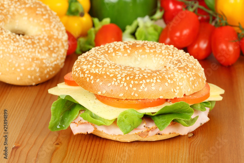Fresh bagel with turkey breast, cheese and salad