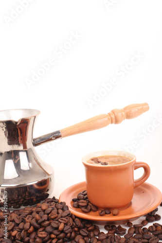 Turk and coffee cup on a white background