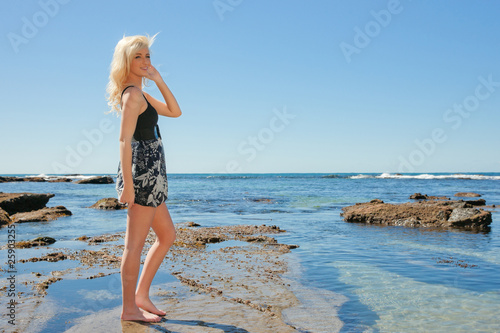 young woman enjoying summer at beach