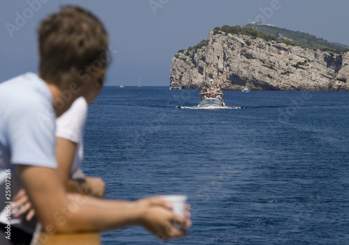 Tourists watching Dugi Otok Cliff at Kornati Islands, Croatia.