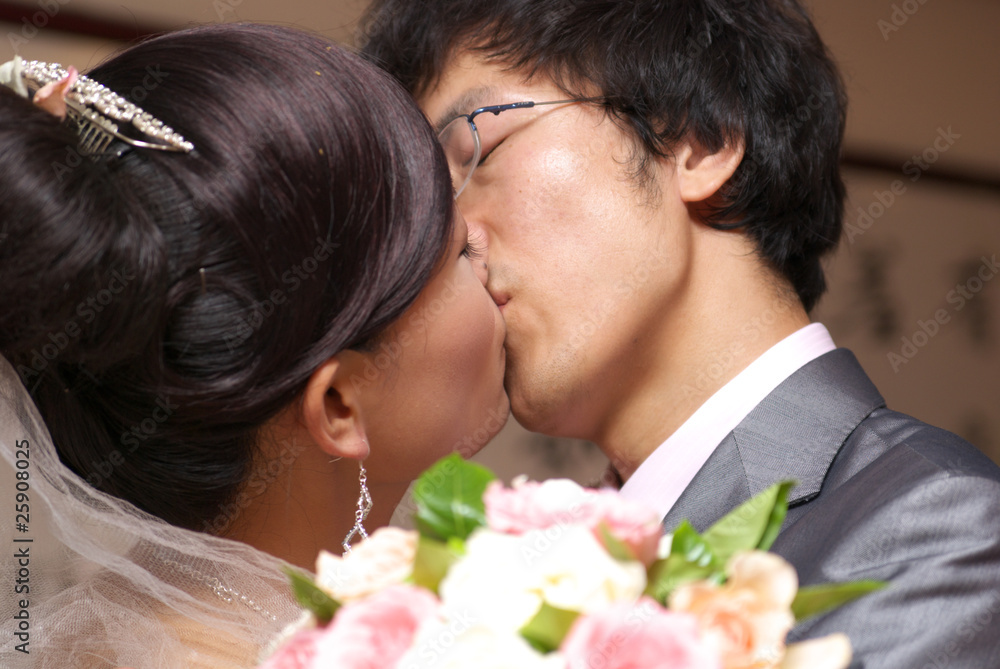 Asian couple kissing Asian couple kissing