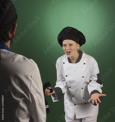 professional cook scolding a cooworker photo