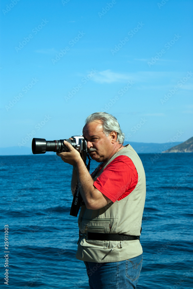 Obraz premium Professional photographer taking pictures