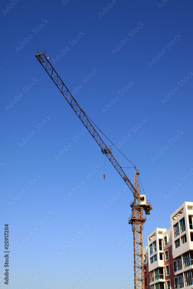 high-rise building and crane high-rise building and crane