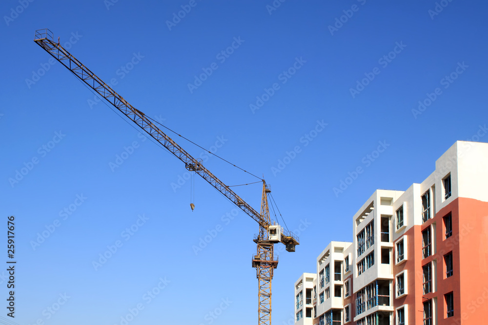 high-rise building and crane high-rise building and crane