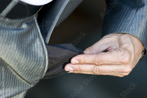 Sad and broke businessman with empty pockets