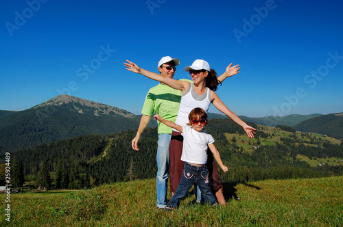Family of three having fun outdoors