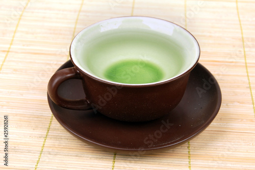 a cup of tea on bamboo tray