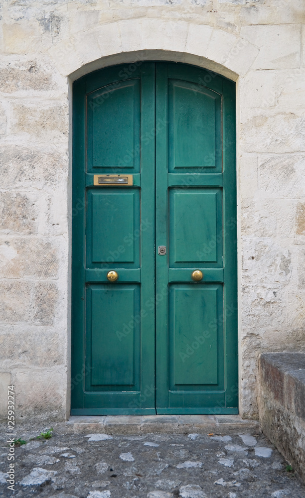 Wooden green door.