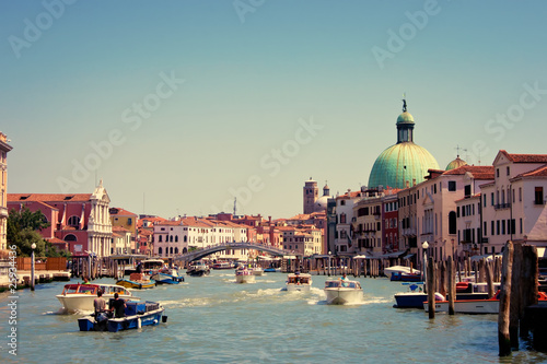 Canal with boats in Venice, Italy. © Eskymaks