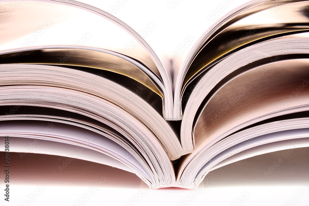 Pile of open magazines isolated on white background Pile of open magazines isolated on white background