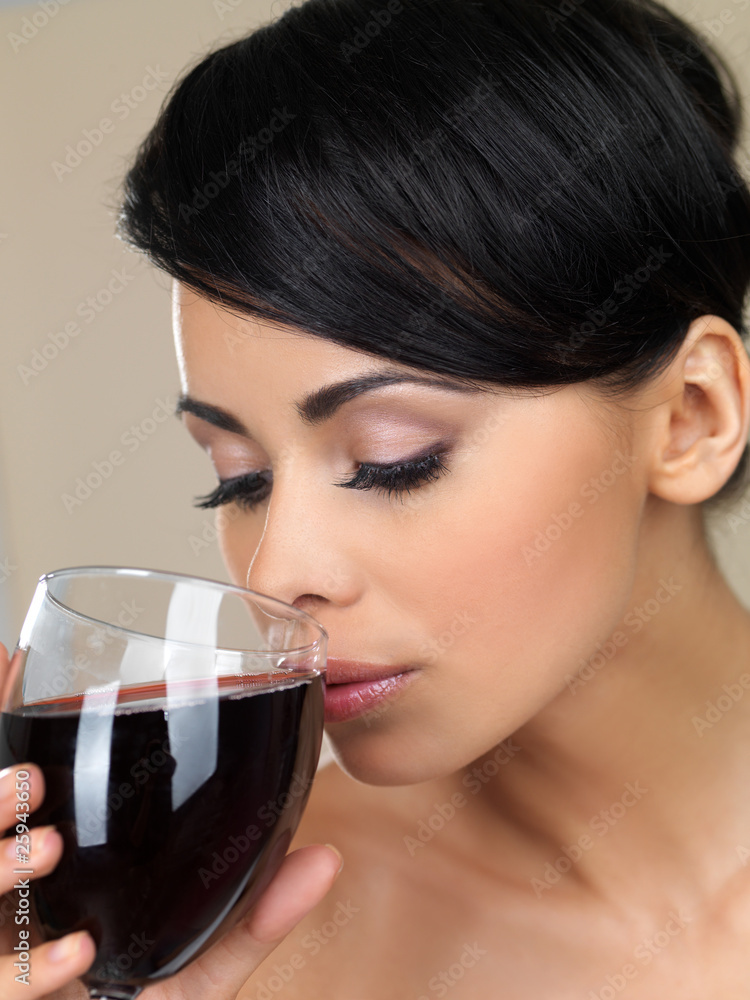 Portrait of beautiful woman, she holding glass of red wine Portrait of beautiful woman, she holding glass of red wine