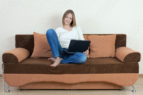 woman with laptop on the sofa