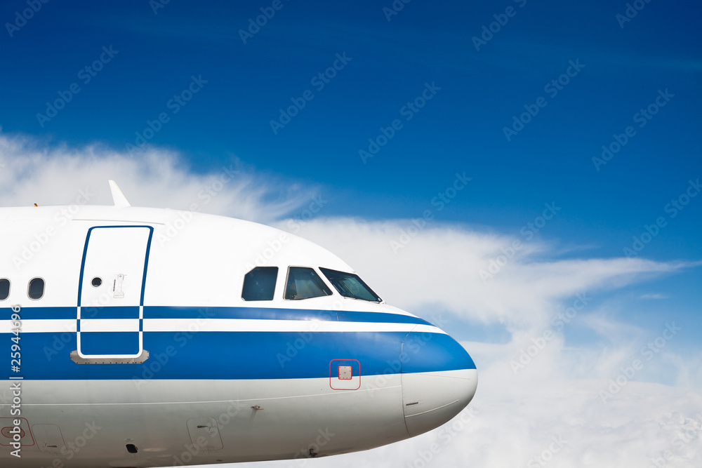 the airplane with the blue sky background.
