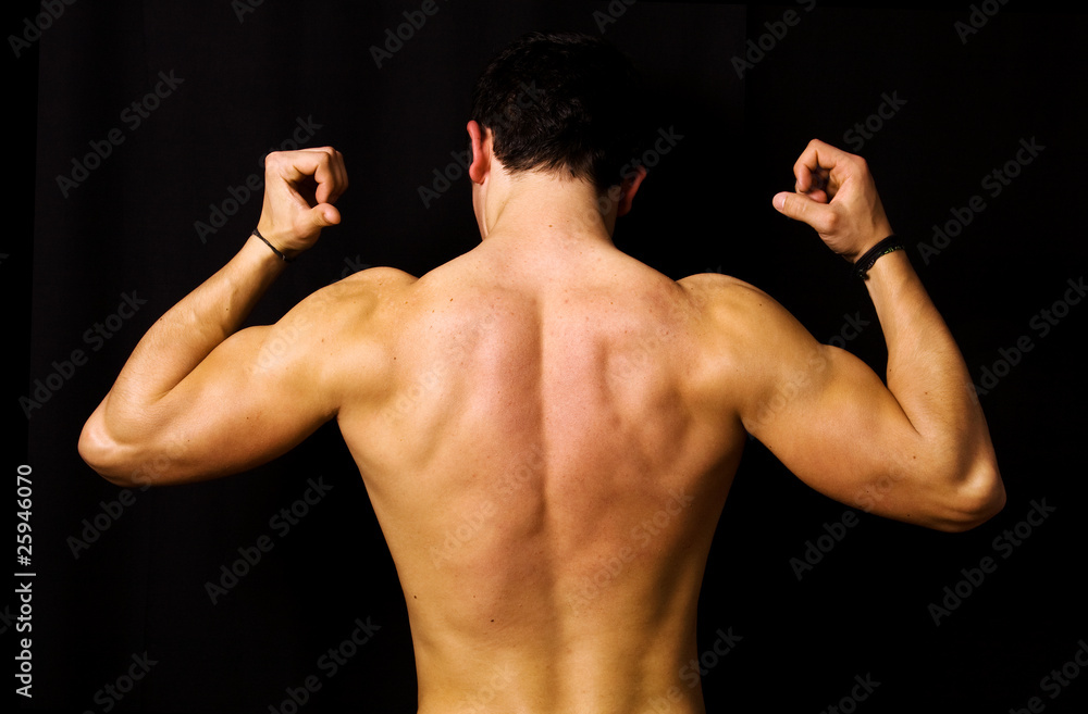 muscular male back on black background