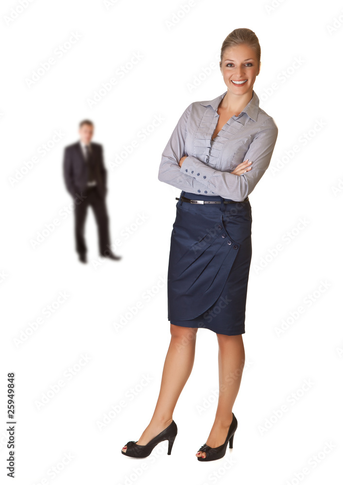 Business woman talking on the phone with man in background Business woman talking on the phone with man in background