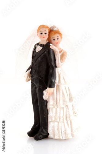 wedding cake figurines on white