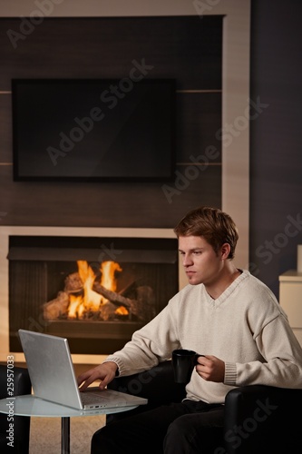 Young man working at home