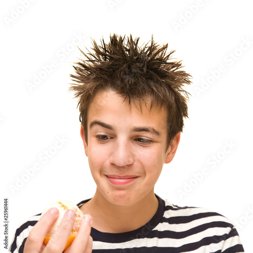 Foto vitamins? surely not? - teenage caucasian boy with ornage
