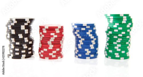 colorful poker casino chips over white background