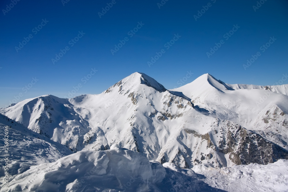 Panorama of winter mountains. Alpine ski resort Bansko, Bulgaria