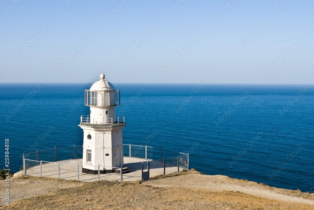 beautiful white lighthouse on a marine cape