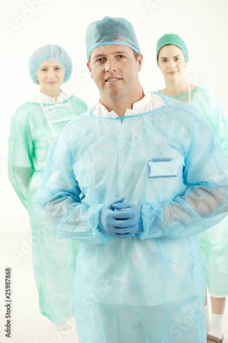 Doctor and two assistant in scrubs