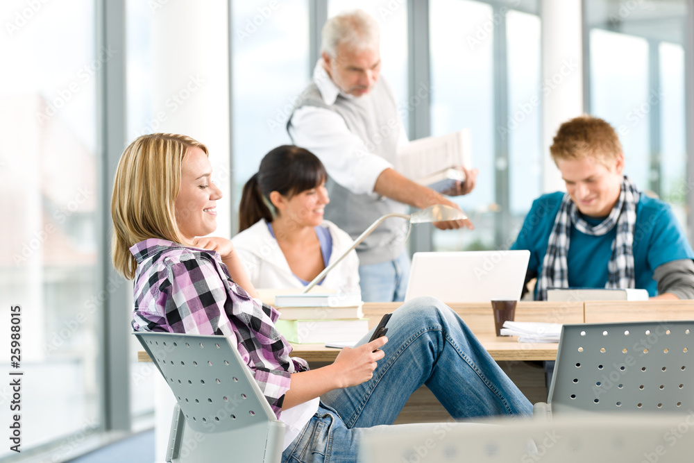 Fototapeta premium High school - three students with professor