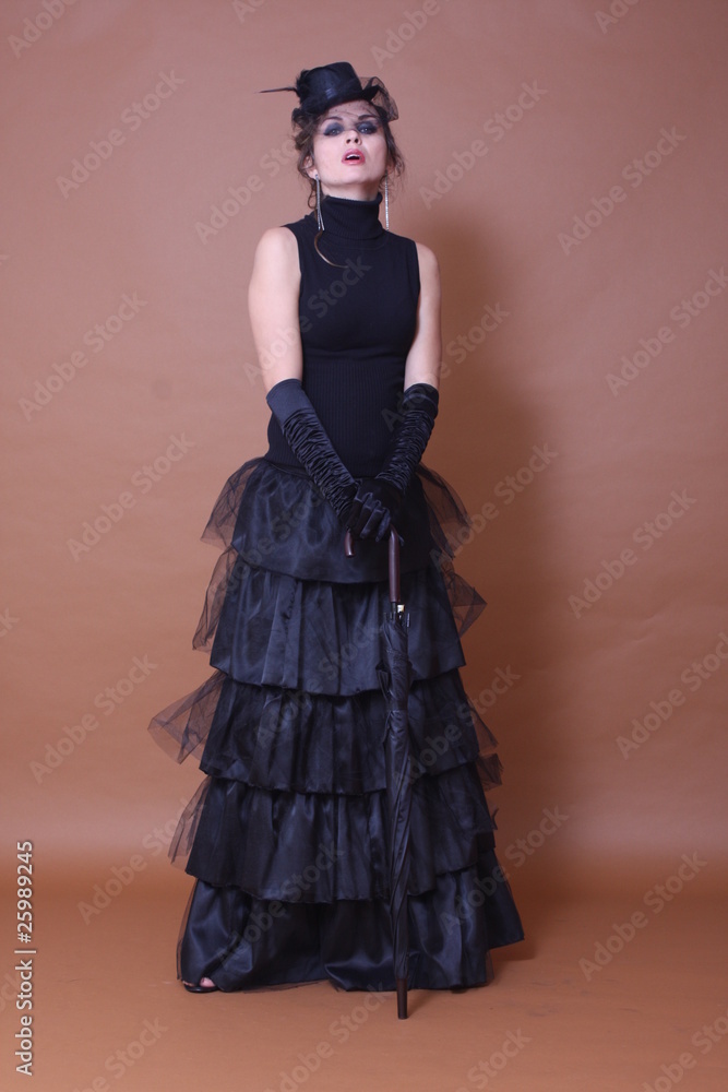 Woman wearing long black dress and satin gloves Woman wearing long black dress and satin gloves