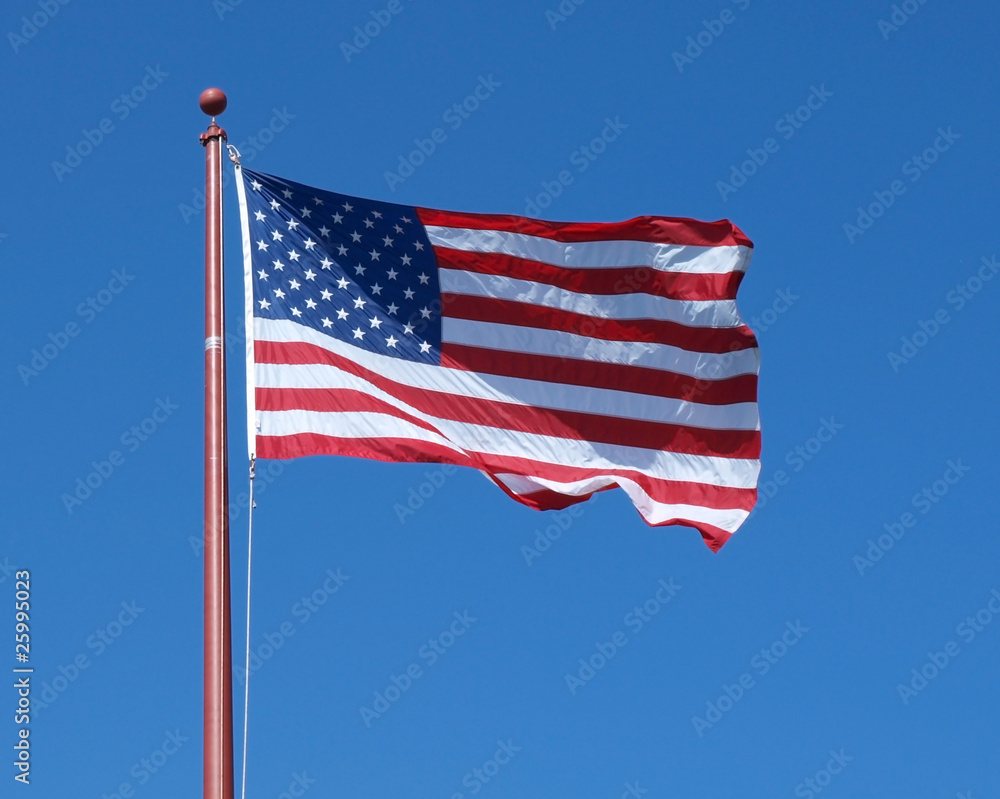 Fototapeta premium U.S. Flag on clear blue sky background