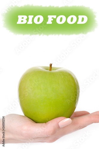 Green apple in a beautiful hand of woman. bio food