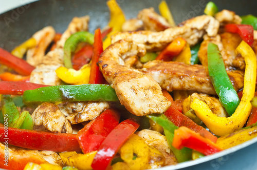 chicken and vegetables stir fried for fajitas