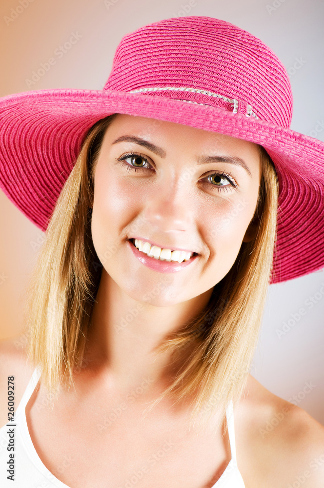 Young girl with beach hat against gradient background Young girl with beach hat against gradient background