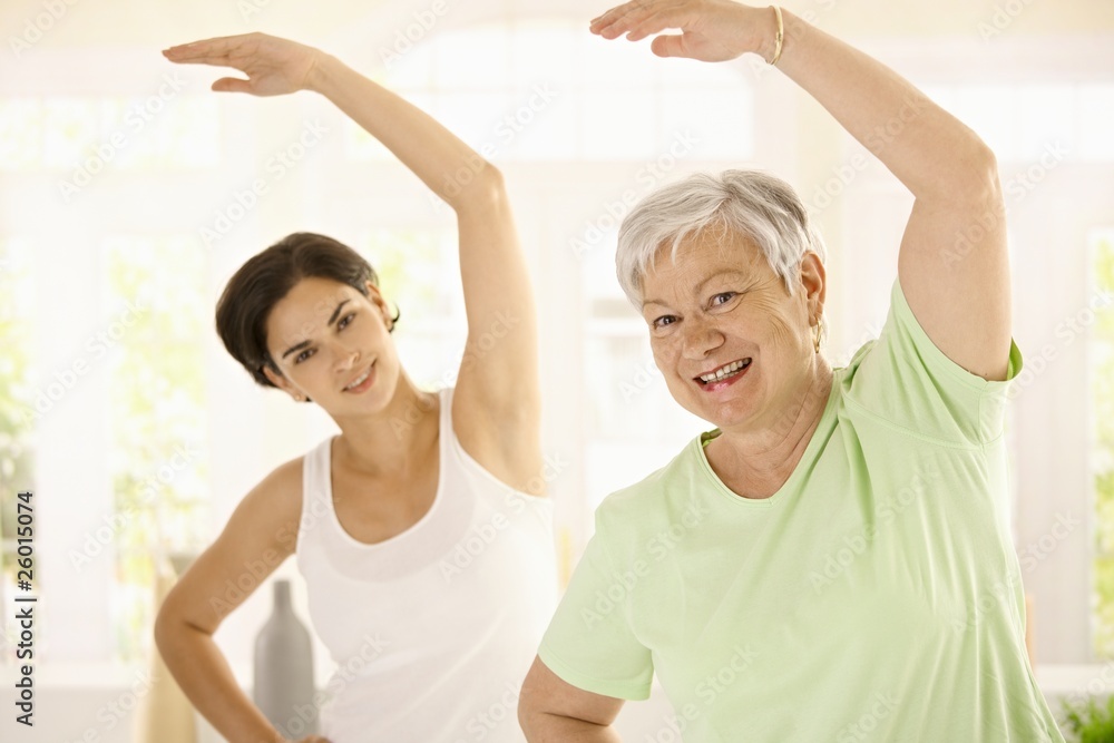 © nyul - Elderly woman with personal fitness trainer